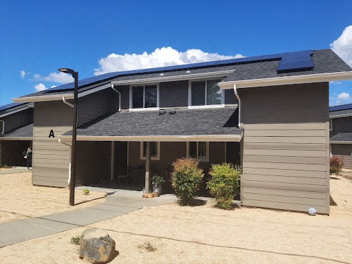 a house with a solar panel on the roof
